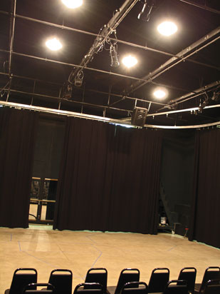 Image of the the McDonald Theatre space including lighting, curtains and floor.