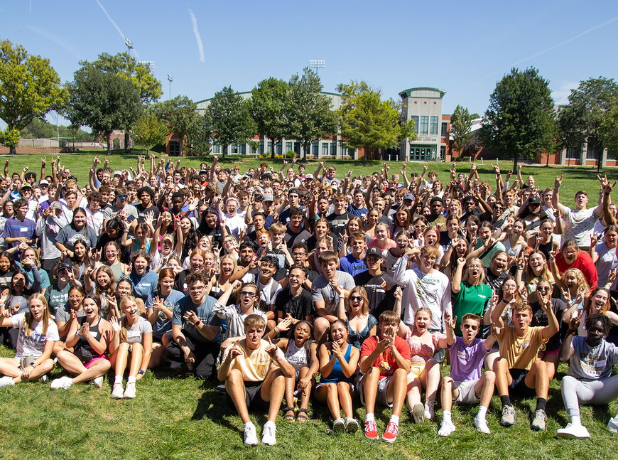 439 first-year students gather on Taylor Commons for a group photo on a bright sunny day.