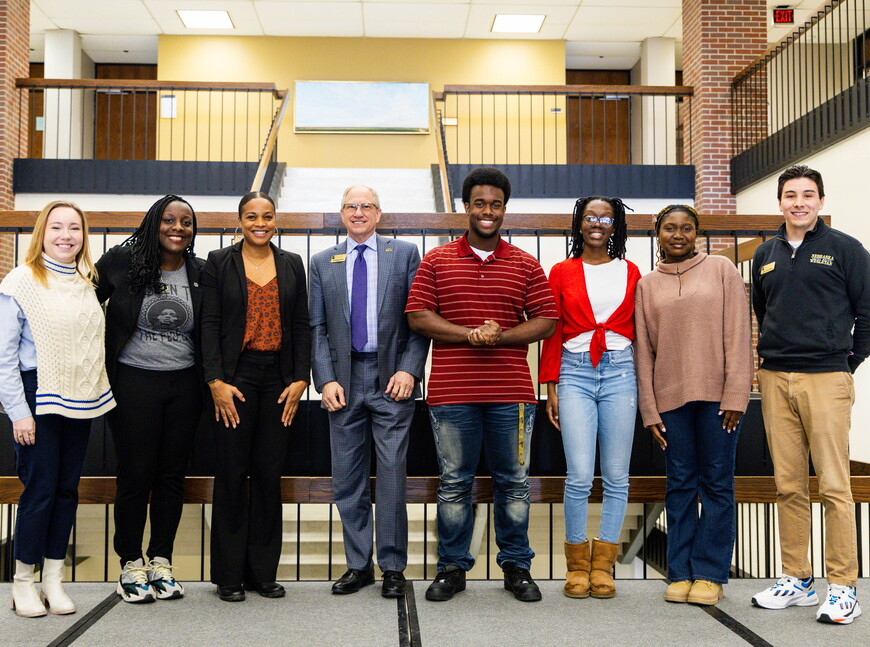 L to R: Claire Shinn and Dominque Kelly with the Boys and Girls Club of Lincoln, Candice Howell, assistant dean with NWU, NWU President Darrin Good, Chevalier Curry,  Aniaya Reed, Amarachi Chidi-Uneze, and Adrian Gomez Ramos, assistant director of diversity and inclusion. 