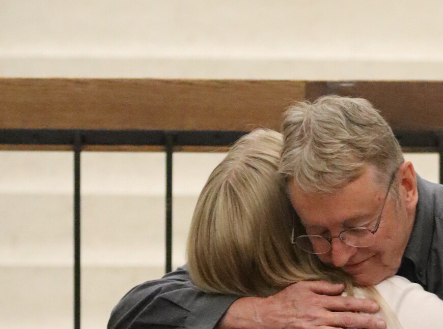 Jeff Mohr hugging Toni Jensen.
