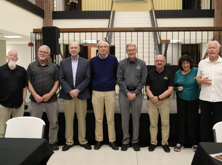 Jay Chipman, Jeffrey Isaacson, Richard Jones, Patrick Hayden-Roy, Jeff Mohr, James Ruzicka and Rebecca Voight pose for a photo.