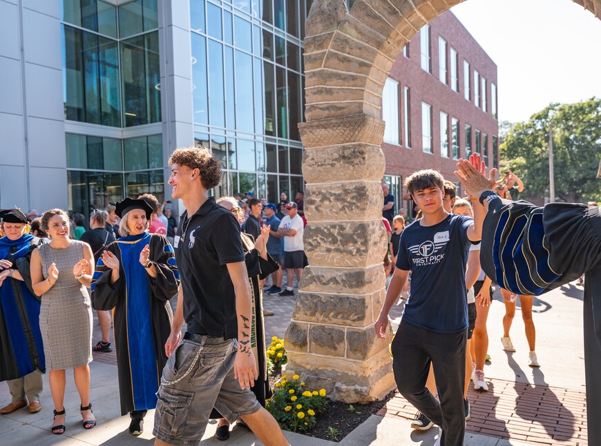 New students complete the First Walk, a campus tradition.