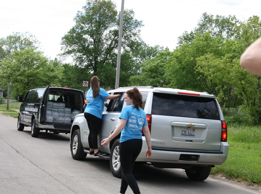 Sophomores Michaela Wells and Laurel Withee traveled to Flint, Michigan, to distribute 15,000 bottles of water over two days last summer. 