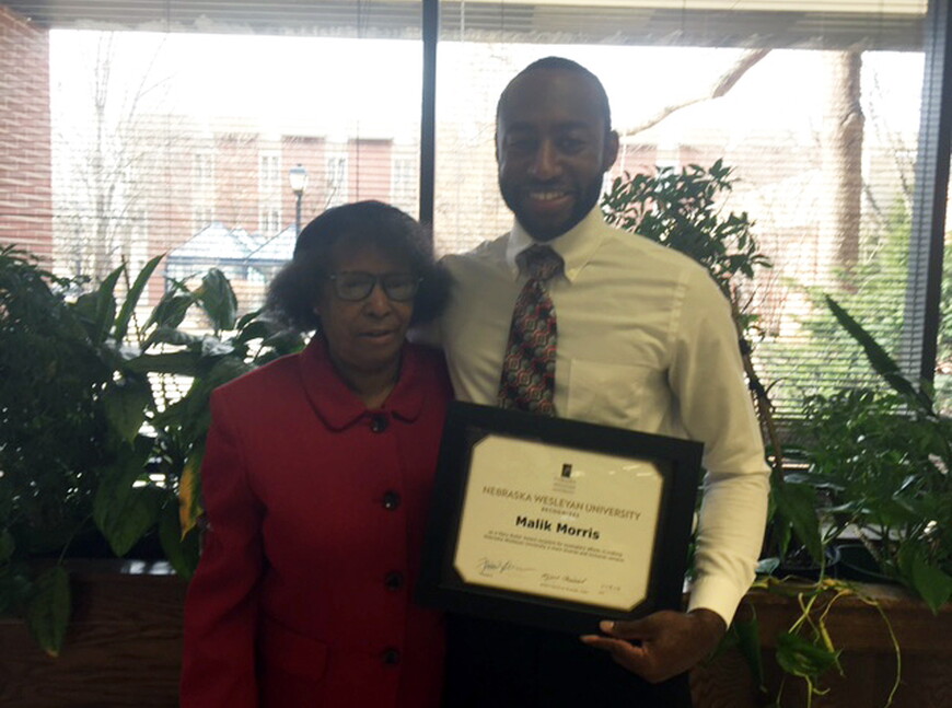Senior psychology major Malik Morris was honored with the Mary Butler Award, which honors a student of color who enriches the campus through extracurricular involvement, leadership, responsibility and concern for others. He is pictured with Mary Butler, w