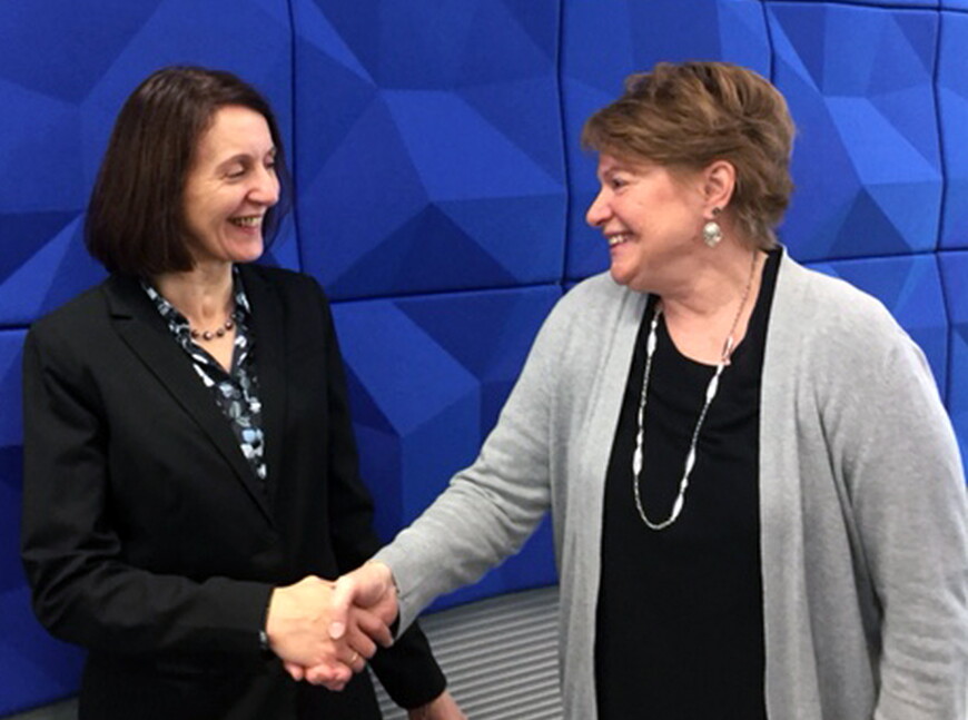 Nebraska Wesleyan Provost Graciela Caneiro-Livingston thanks Sue Raftery, associate vice president of academic affairs at Metropolitan Community College, on a new partnership between the two schools, which will open more doors to bachelor's degree complet