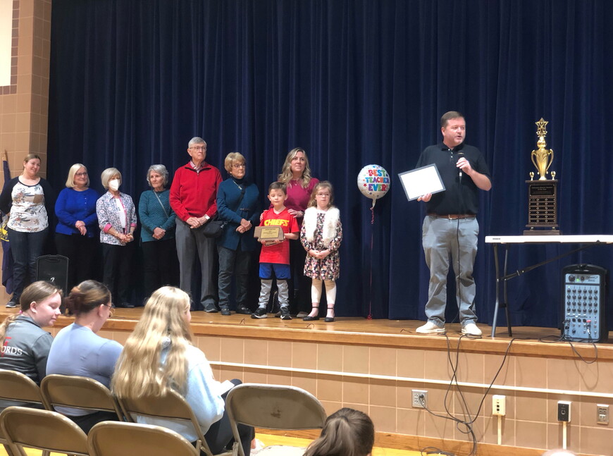 Jason Krueger receives award at Park Middle School.