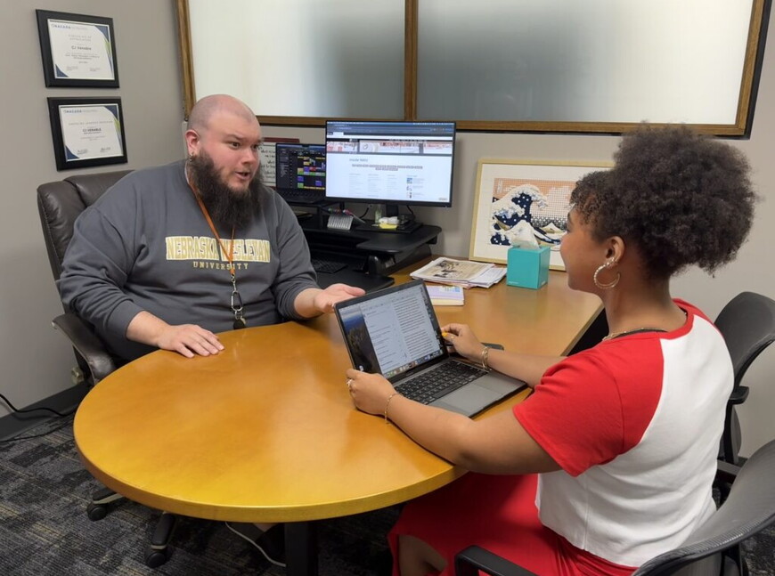 An advisor meeting with a student