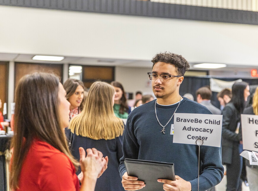 Student talking to faculty member
