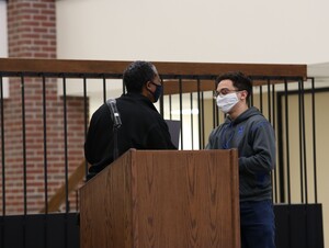 Quentin Reese receives his diversity advocate award at Nebraska Wesleyan’s Martin Luther King Jr. Day celebration from Wendy Hunt, assistant director of diversity and inclusion.