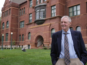 Tom Osborne in front of Old Main 