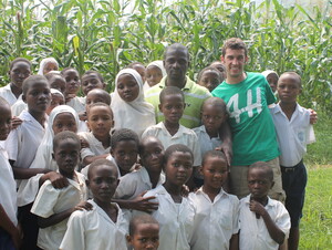 The school children show Shepherd their corn crop