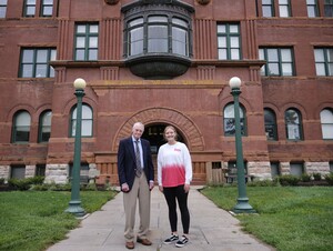 Tom Osborne and Allison Nesbitt in front of Old Main