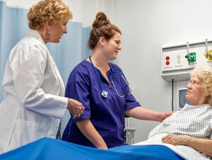 Nurses working with patient 
