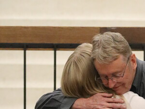 Jeff Mohr hugging Toni Jensen.
