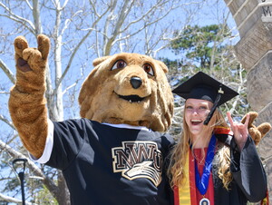 Student and Prairie Wolf at commencement 