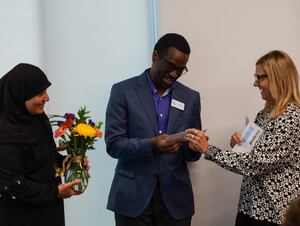 Connie Duncan presents representatives of the Good Neighbor Community Center with a $10,000 check.