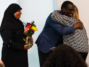 Connie Duncan presents representatives of the Good Neighbor Community Center with a $10,000 check.