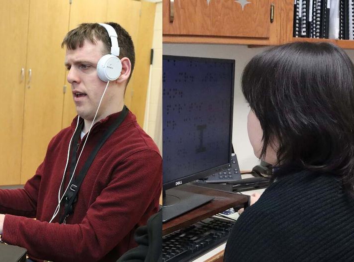 Lincoln Public Schools employees Brandon Peters and Sam Bomberger work in their offices. 