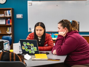 Two girls looking at a computer