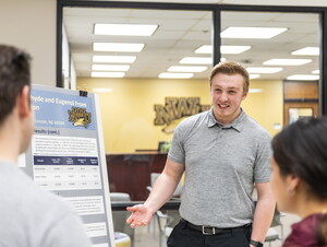 Student presenting at symposium