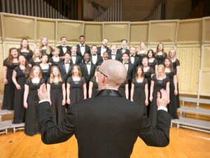 Tom Trenney conducting NWU's choir 