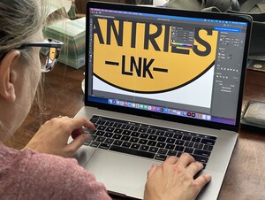 Melanie designing the "Little Free Pantries" logo