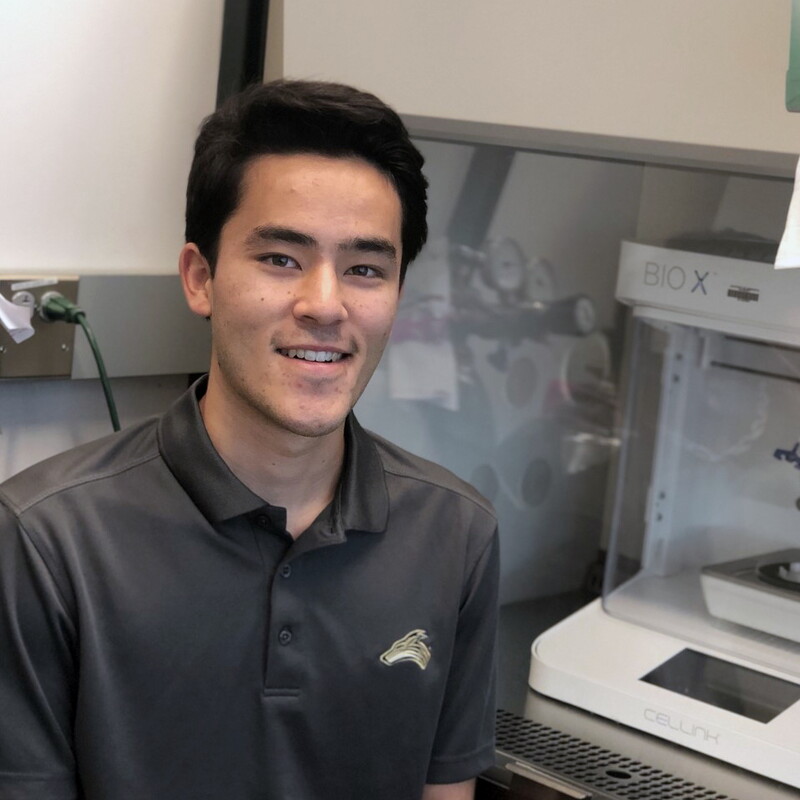 Anthony Baker, psychology student, in a lab doing research.