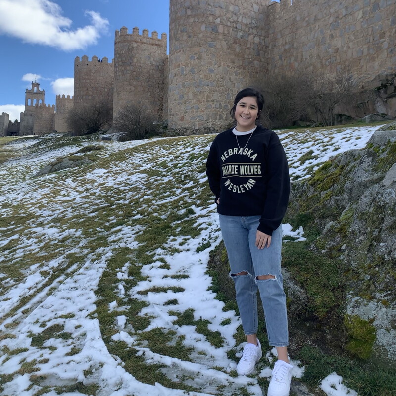 Jacqueline Garcia standing in front of a castle in Spain