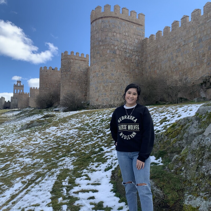 Jacqueline Garcia standing in front of a castle in Spain