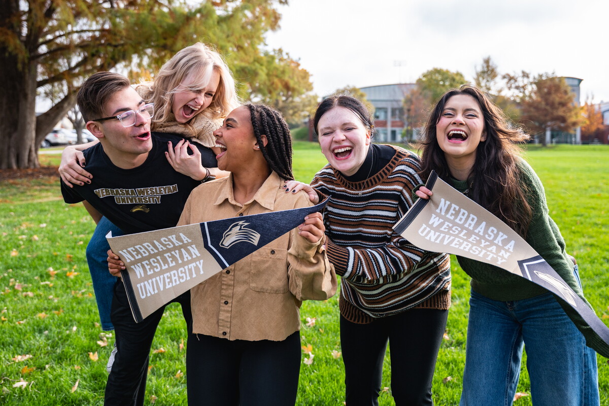 Students holding pennants
