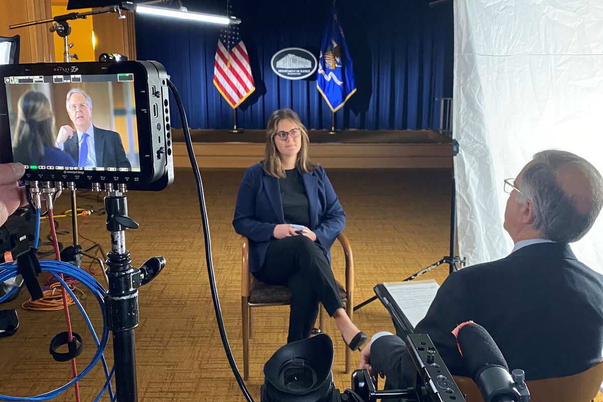 NWU student conducts video interview with State Department employee.