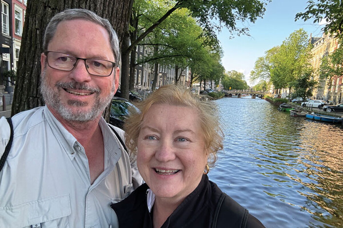 Paul and Pat Pettit outside in front of a lake.