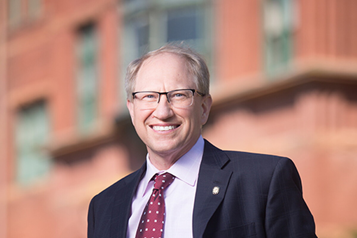 Darrin Good in front of Old Main