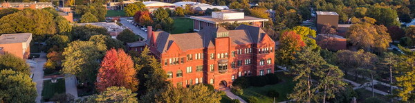 Aerial view of Old Main in the fall at dusk.