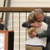 Jeff Mohr hugging Toni Jensen.