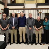 Jay Chipman, Jeffrey Isaacson, Richard Jones, Patrick Hayden-Roy, Jeff Mohr, James Ruzicka and Rebecca Voight pose for a photo.