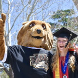 Student and Prairie Wolf at commencement 