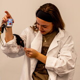 A student rewards her rat during the 2025 Xtreme Rat Challenge.