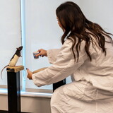 A student trainer rewards her rat during the 2025 Xtreme Rat Challenge.