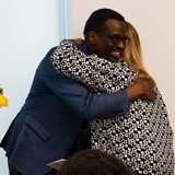 Connie Duncan presents representatives of the Good Neighbor Community Center with a $10,000 check.