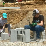 GSL members spent six days mixing cement, chipping and shaping cinder blocks, and digging foundations for two new homes.